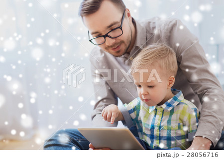 father and son with tablet pc playing at home 28056716
