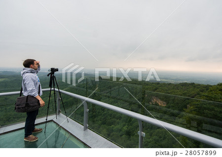 Nature photographer taking photos in the mountains Nature photographer taking photos in the mountains 28057899