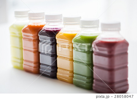 bottles with different fruit or vegetable juices bottles with different fruit or vegetable juices 28058047