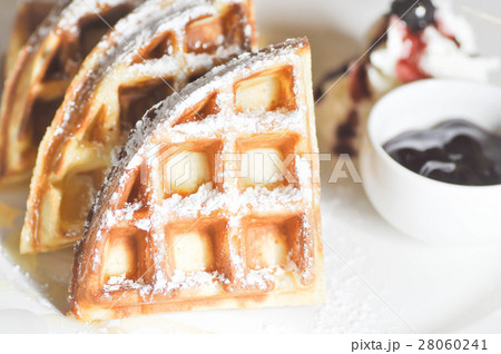 waffle with icing sugar and blueberry dip waffle with icing sugar and blueberry dip 28060241