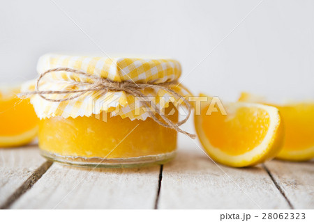 Orange marmalade on white table 28062323
