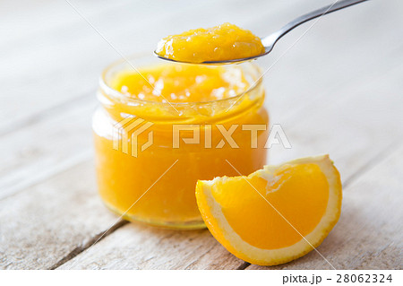 Orange marmalade on white table Orange marmalade on white table 28062324