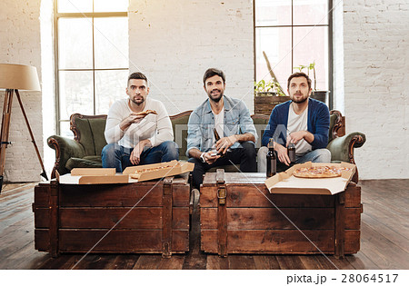 Good looking young men watching TV 28064517