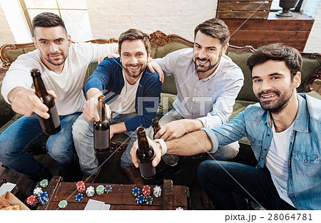 Good looking positive men stretching out their 28064781