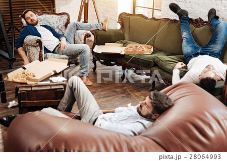 Nice pleasant man lying on the sofa 28064993