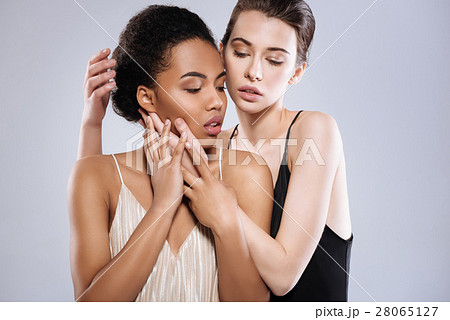 Two emotional young ladies demonstrating affection 28065127