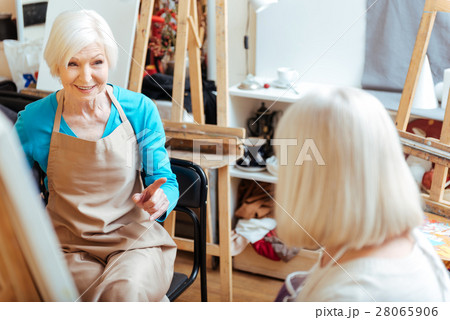 Elderly women talking in painting class Elderly women talking in painting class 28065906