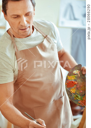 Overjoyed man holding palette and brush 28066290