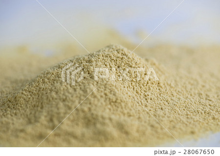 Pile of dry ginger powder isolated 28067650