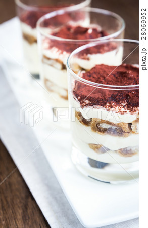 Tiramisu in the glasses on the wooden background 28069952