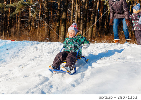 Happy young woman with two children Happy young woman with two children 28071353