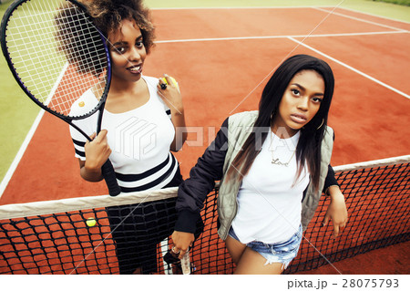 young pretty girlfriends hanging on tennis court 28075793