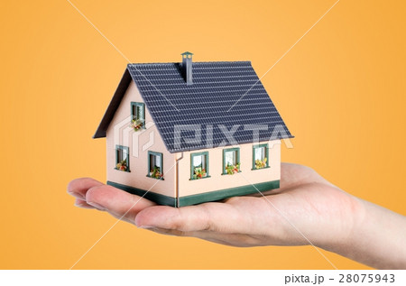 Hand holding house miniature. Home finance concept Hand holding house miniature. Home finance concept 28075943