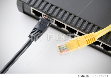 Network switch device and ethernet cables on white Network switch device and ethernet cables on white 28076023
