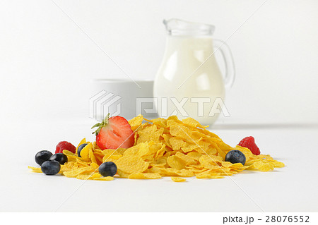 jug of milk and corn flakes with fruits 28076552