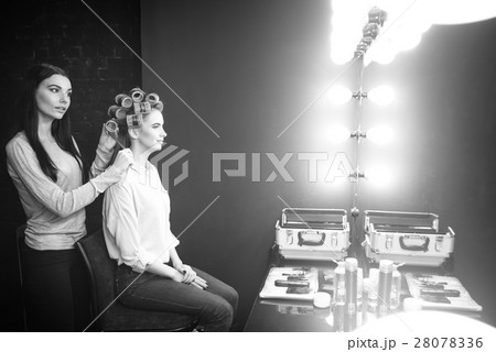 Good looking skillful hairdresser using hair Good looking skillful hairdresser using hair 28078336