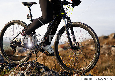 Close-up view on a cyclist  from below 28079715