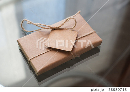 gift in a cardboard box on white background gift in a cardboard box on white background 28080718