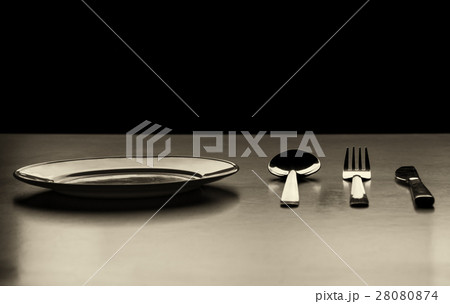Empty plate with spoon, knife and fork Empty plate with spoon, knife and fork 28080874