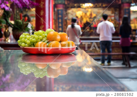 Fruits placed on the wooden altar in temple 28081502