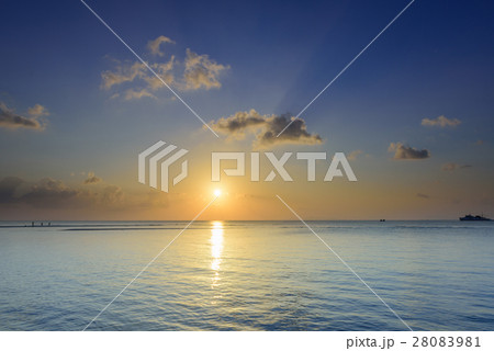 Seascape sunset with golden light and blue sea sky Seascape sunset with golden light and blue sea sky 28083981
