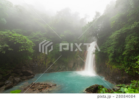 Rio celeste waterfall at foggy day 28084084