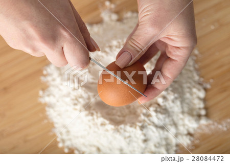 Cook adds an egg Cook adds an egg 28084472