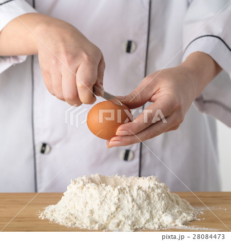 Cook adds an egg Cook adds an egg 28084473
