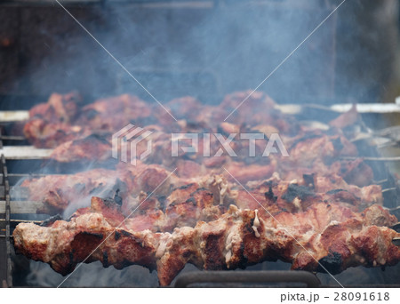 Cooking kebabs on the coals in the winter 28091618