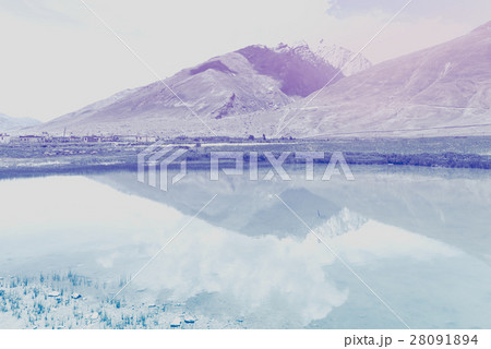 Retro snow pean and green valley landscape  28091894