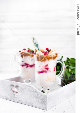 dessert in a glass on a wooden tray 28094581