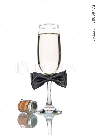 Glass of champagne with black bow tie Glass of champagne with black bow tie 28099472