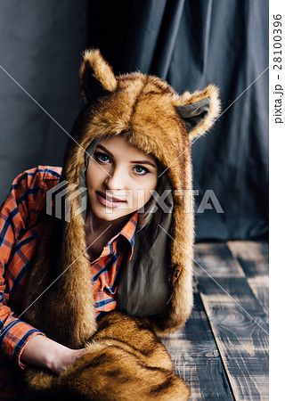 beautiful sexy girl wearing brown fur hat 28100396