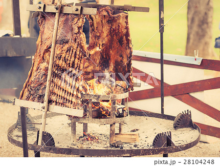Traditional Argentinian asado roasted grilled meat Traditional Argentinian asado roasted grilled meat 28104248