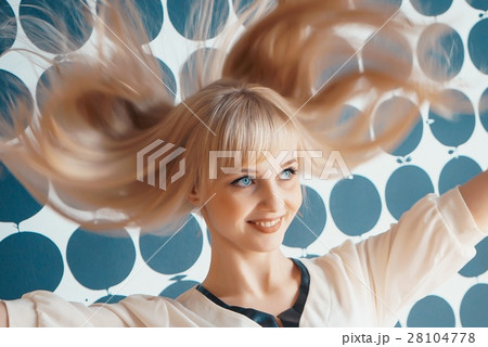 Girl shakes your head and smiles for camera Girl shakes your head and smiles for camera 28104778