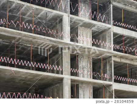 Unfinished gray building under construction  28104859