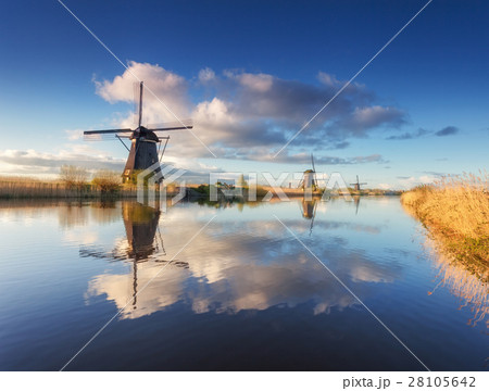 Rustic landscape with beautiful windmills 28105642