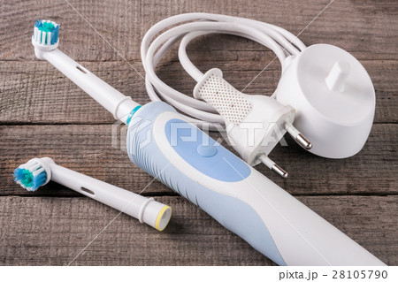 Electric Toothbrush on an old wooden background 28105790