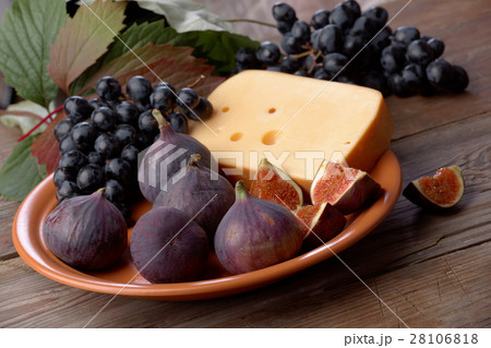 Cheese, grapes and figs on a dish Cheese, grapes and figs on a dish 28106818