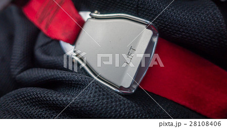 Close up of safety seat belt in the airplane . Close up of safety seat belt in the airplane . 28108406