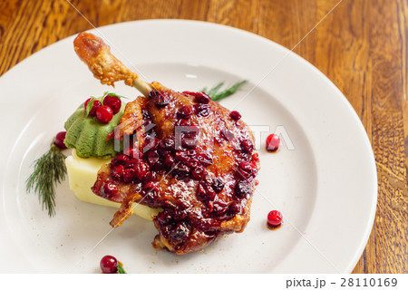 roasted duck leg with cranberry sauce roasted duck leg with cranberry sauce 28110169