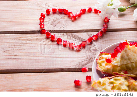 Red heart from grains of ripe pomegranate Red heart from grains of ripe pomegranate 28123142