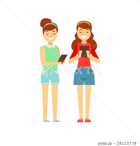 Two Girls Tooking At Their Tablets Standing 28123778