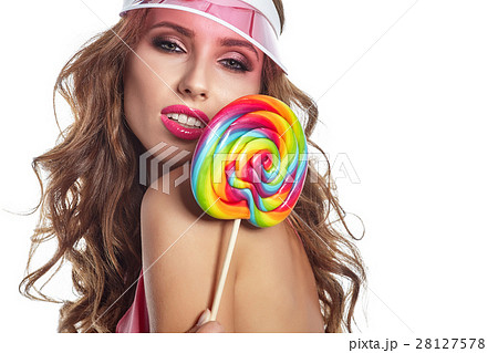 Beautiful amazing sexy smiling woman with a lollipop on white ba 28127578
