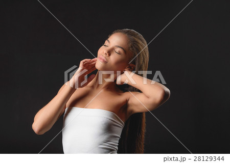 Calm mulatto woman is satisfied by her skin 28129344