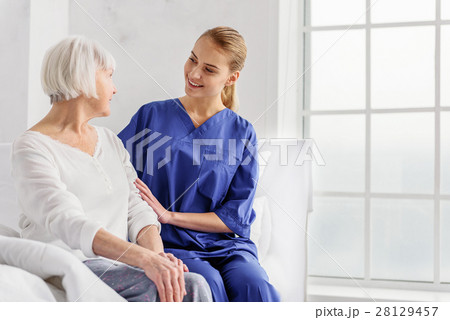 Doctor telling pensioner about her health state 28129457