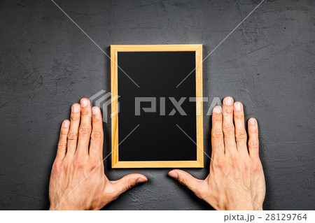 Picture frame on dark background 28129764