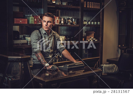 Professional hairstylist in barbershop interior Professional hairstylist in barbershop interior 28131567