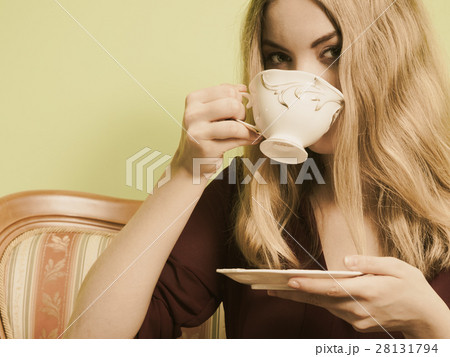 Woman drinking hot coffee beverage. Caffeine. Woman drinking hot coffee beverage. Caffeine. 28131794