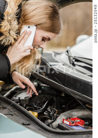 Broken down car, woman calling to somebody Broken down car, woman calling to somebody 28132049